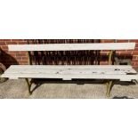 Green painted metal framed bench with white painted wooden slats,