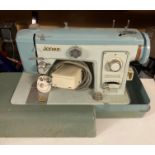 Jones model: 881 electric sewing machine in carry case (PO)