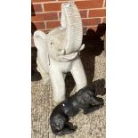 Two items - seated concrete elephant - 70cm high and a black painted concrete Labrador (2)