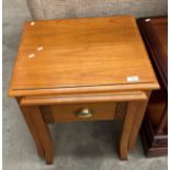 A yew finish nest of two tables - the bottom one with a drawer.