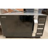 Sharp black and satin 900W microwave oven model R360SLM 240 volt.