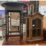 A small oak side table with barley twist legs and a small oak glazed door corner wall cabinet,