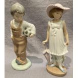 Two boxed Nao figurines 'boy with football' no. 01059, 19cm, and 'girl with parasol' no.