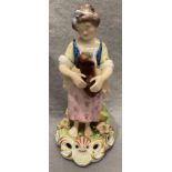 A Crown Derby porcelain figure woman with dog, 18cm high.