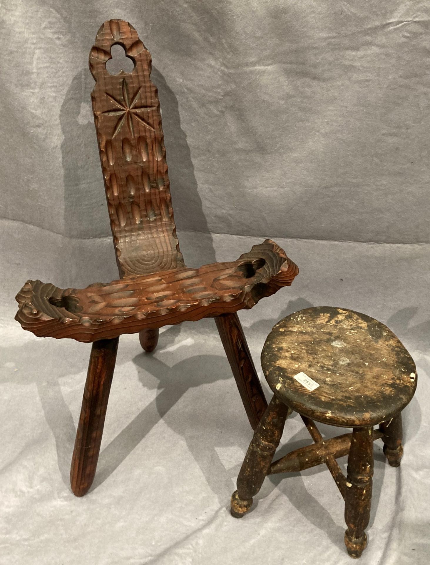 A carved wood Welsh stool and a small elm stool (2) Further Information Stool has