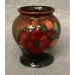 A Moorcroft small brown and green glazed floral vase, 8.