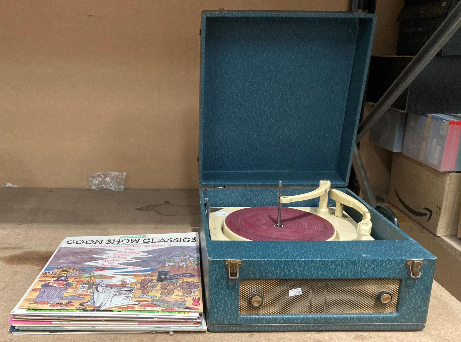 A Collard Conquest table top record player and fourteen LPs,