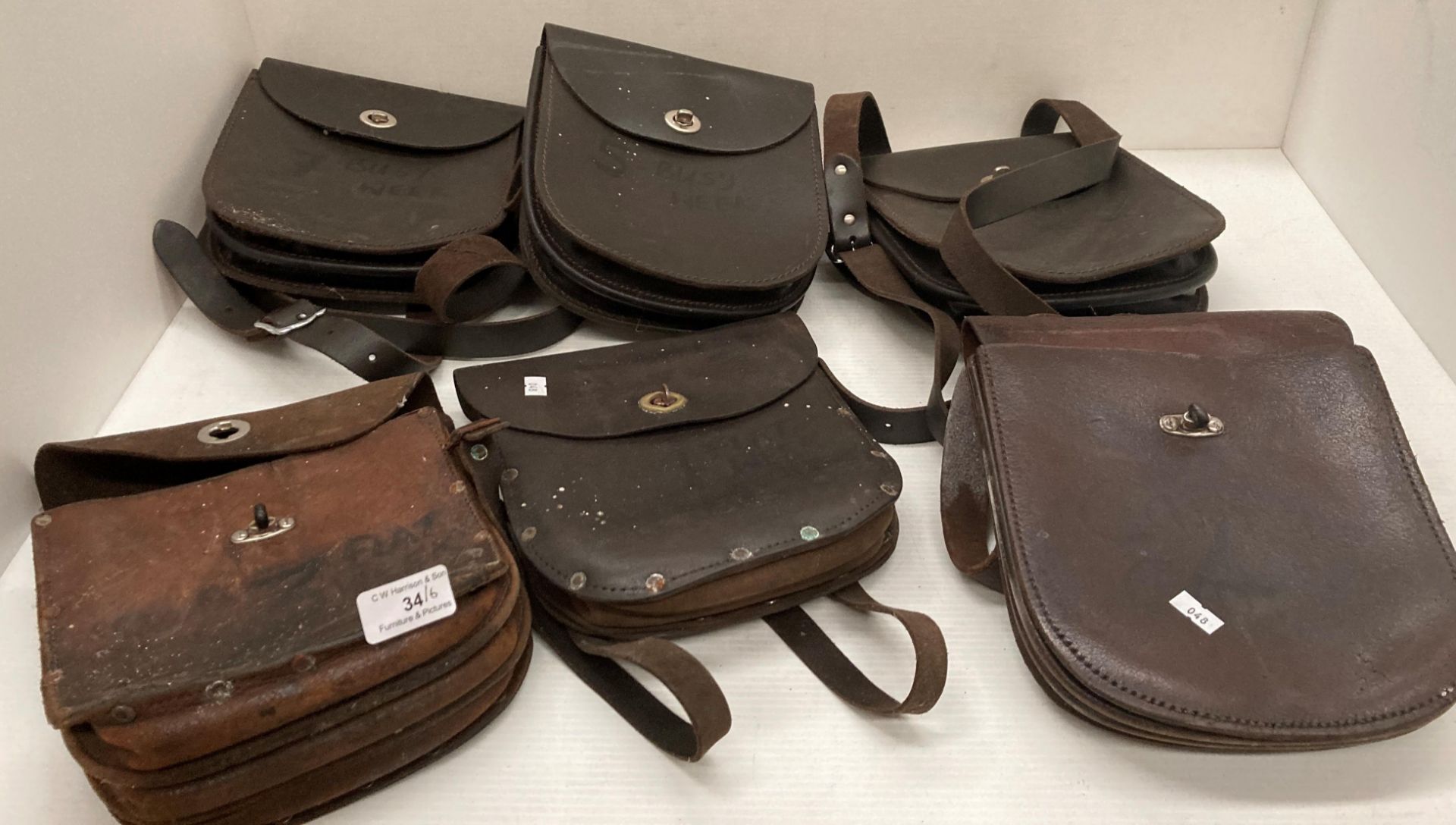 Six coalmen's brown leather money collection bags (one missing straps)