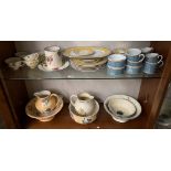 Contents to two shelves - two floral patterned jugs and bowls, two other bowls,