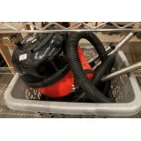 A Numatic Henry tub vacuum cleaner and accessories.