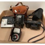 An Ensign Ful-vu box camera in canvas case, a Pentax Pro Quartz camera in case,