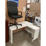 An Ikea white melamine office table with L-shaped extension 152cm x 66cm plus 70cm x 40cm extension