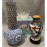 A modern oriental blue patterned cloisonné vase on small stand, 18.