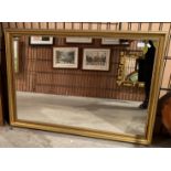 A large gilt framed wall mirror,
