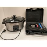 Two items - Cookworks slow cooker 240v and a Highlander portable gas stove.