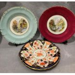 A pair of Royal Crown Derby plates 'Waterfall, Dovedale' and 'Lathkill Dale', each 25cm,