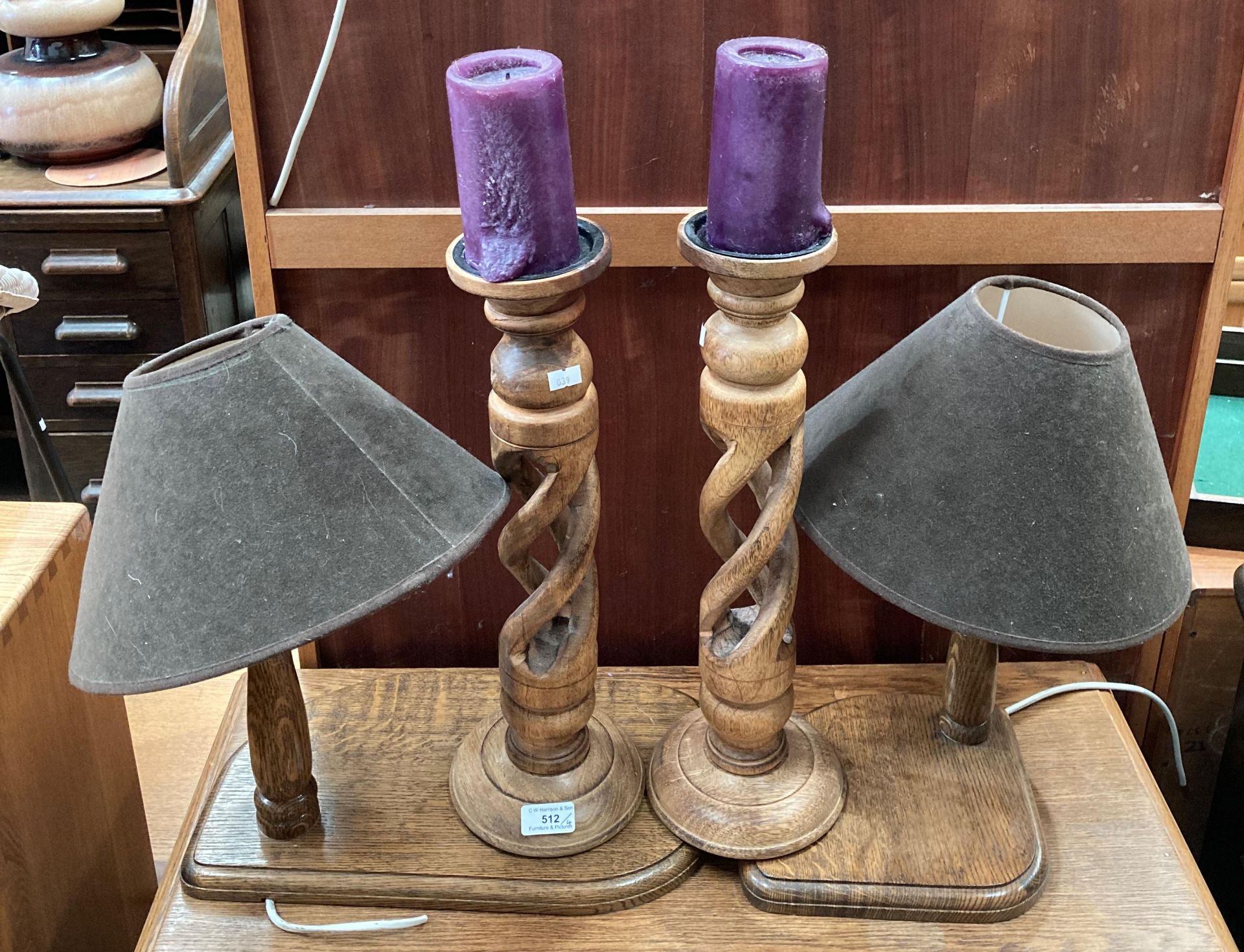 Pair of oak matching twisted candle stick stands 46cm high and a pair of oak table lamps with