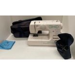 A Cooper Pro 27 240v portable sewing machine in blue vinyl bag