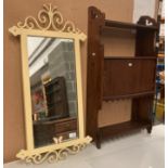 A small oak wall cabinet with three shelves and single door,