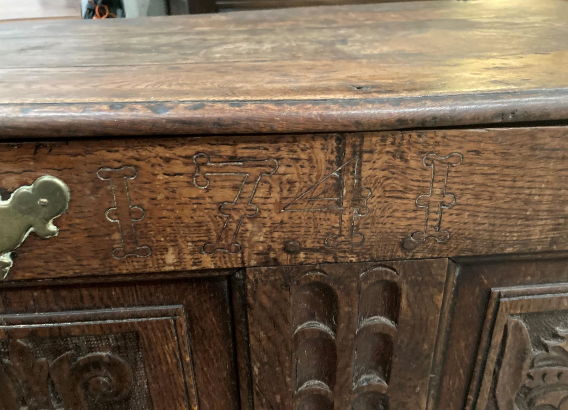 An oak kist with carved three panel front over two drawers, lettered to either side of lock FA1741, - Image 3 of 15