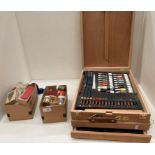 A wooden cased painting set - used and may be incomplete,