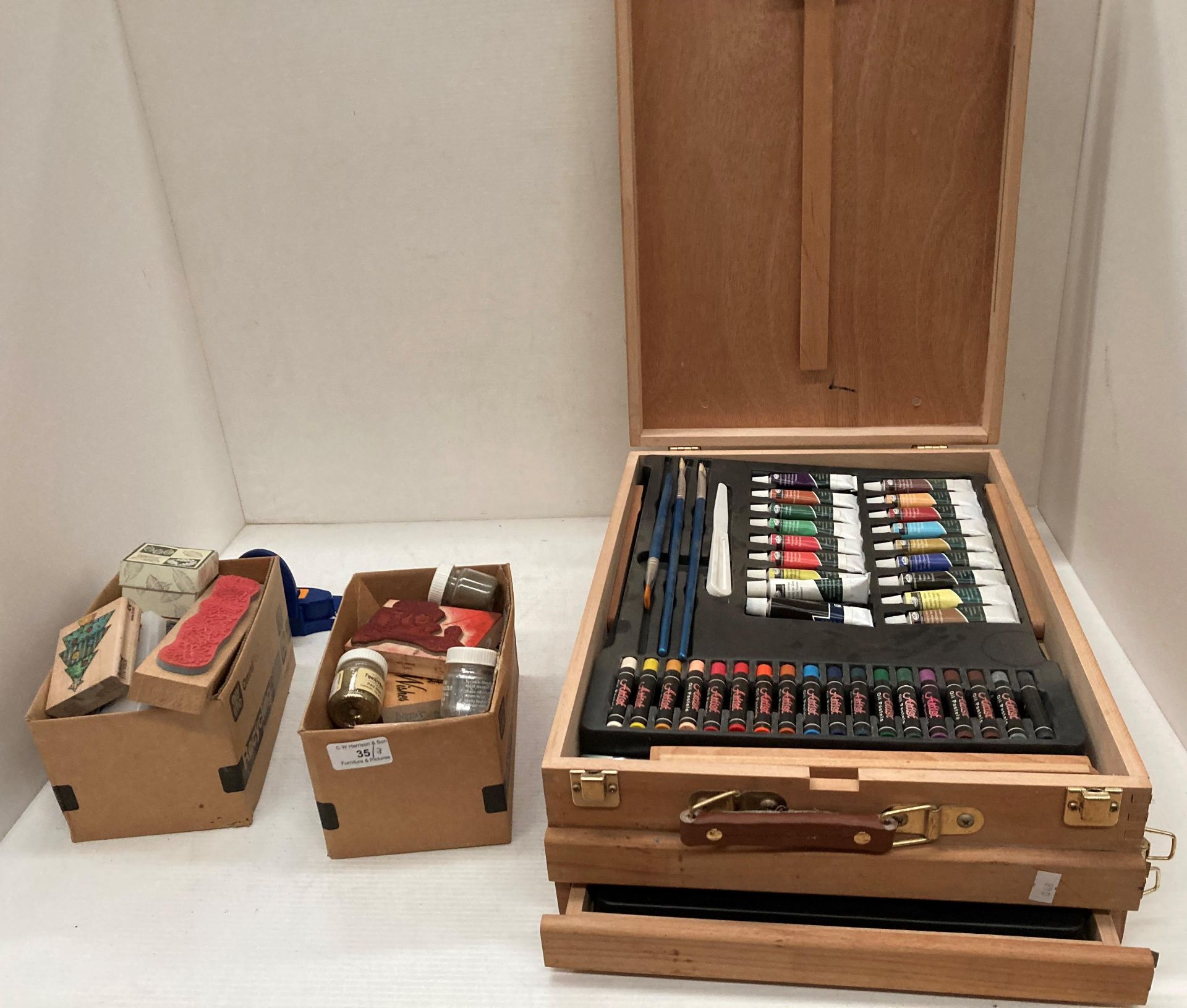 A wooden cased painting set - used and may be incomplete,