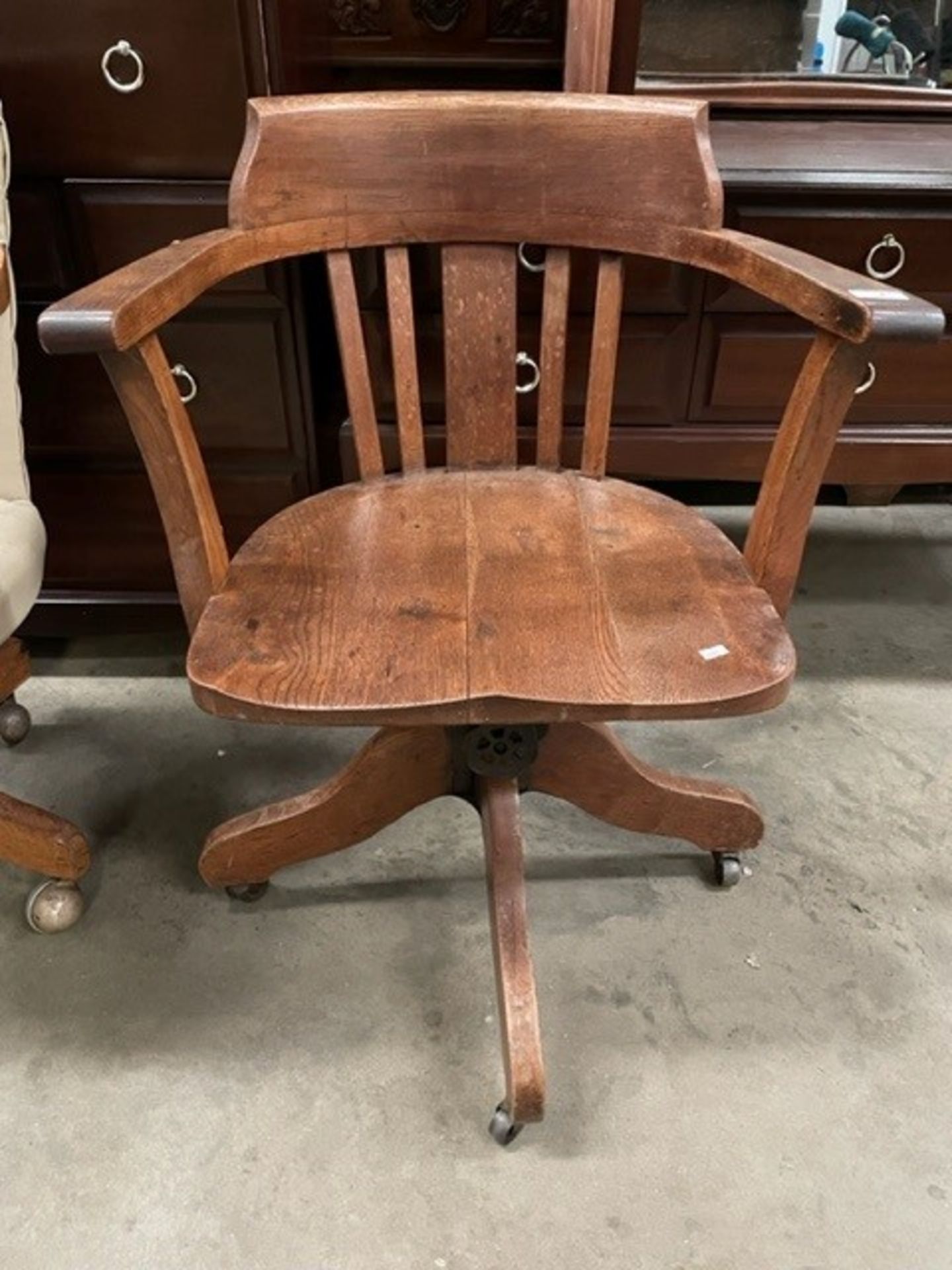 An oak swivel office armchair by Hillcrest.