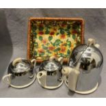 A Celtic Beehive Deco Style three piece white pottery tea service with chrome mounts complete with