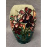 A Moorcroft ovoid pottery green ground floral vase,