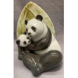 A Nao handmade porcelain figurine 'Panda Love' no. 02001729, dated 2012, max height 18.