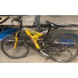 A Cross Nomad Horizon 18 speed mountain bike with front and rear suspension.
