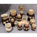 A collection of Goebel W Germany pottery monks, 11cm, in a variety of sizes and poses,