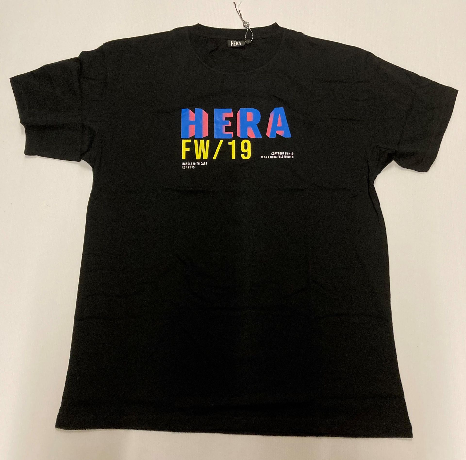 4 x items - 3 x Hera t-shirts, black with blue and pink text (2 x L, 1 x M) and 1 x Hera t-shirt,