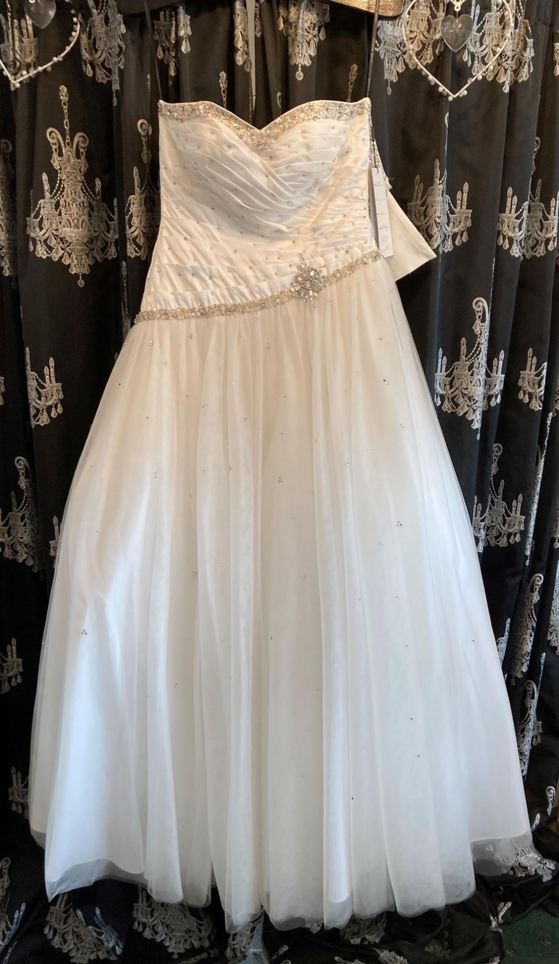 Ivory ball gown, size UK 10. To be collected from: The Gown Room, 46a Valley Road, Pudsey, LS28 9ER.