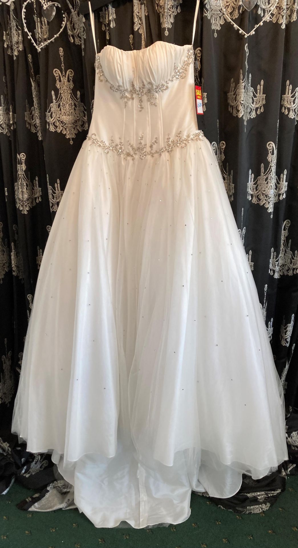 Ivory ball gown, size UK 8. To be collected from: The Gown Room, 46a Valley Road, Pudsey, LS28 9ER.