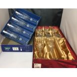 A set of four Cristal D'Argues Danube wine glasses in box and a set of five Royal Brieley wine