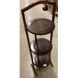 An oak folding three tier cake stand (location J05)