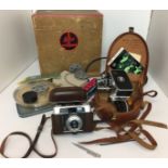 Two cameras a Bolex Paillard D8L cine camera with case and instruction manual,