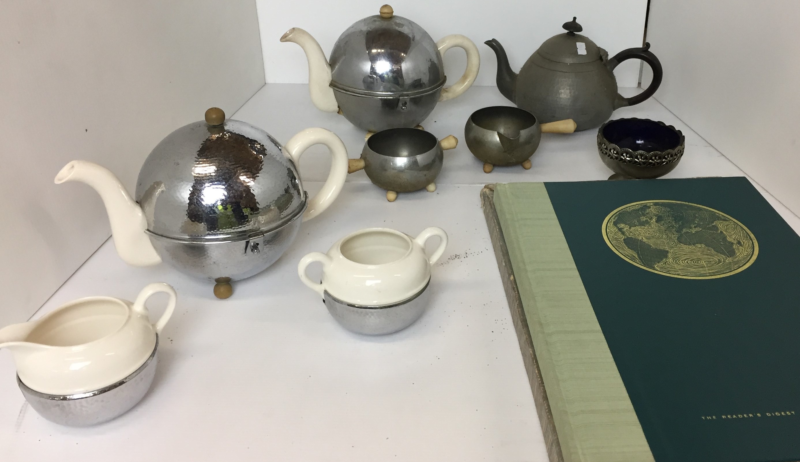 Nine items including two three piece vintage metal and ceramic tea services with insulated teapots,