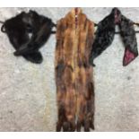 Three fur accessories - two black collars and a long mink stole (Saleroom location: on rail at