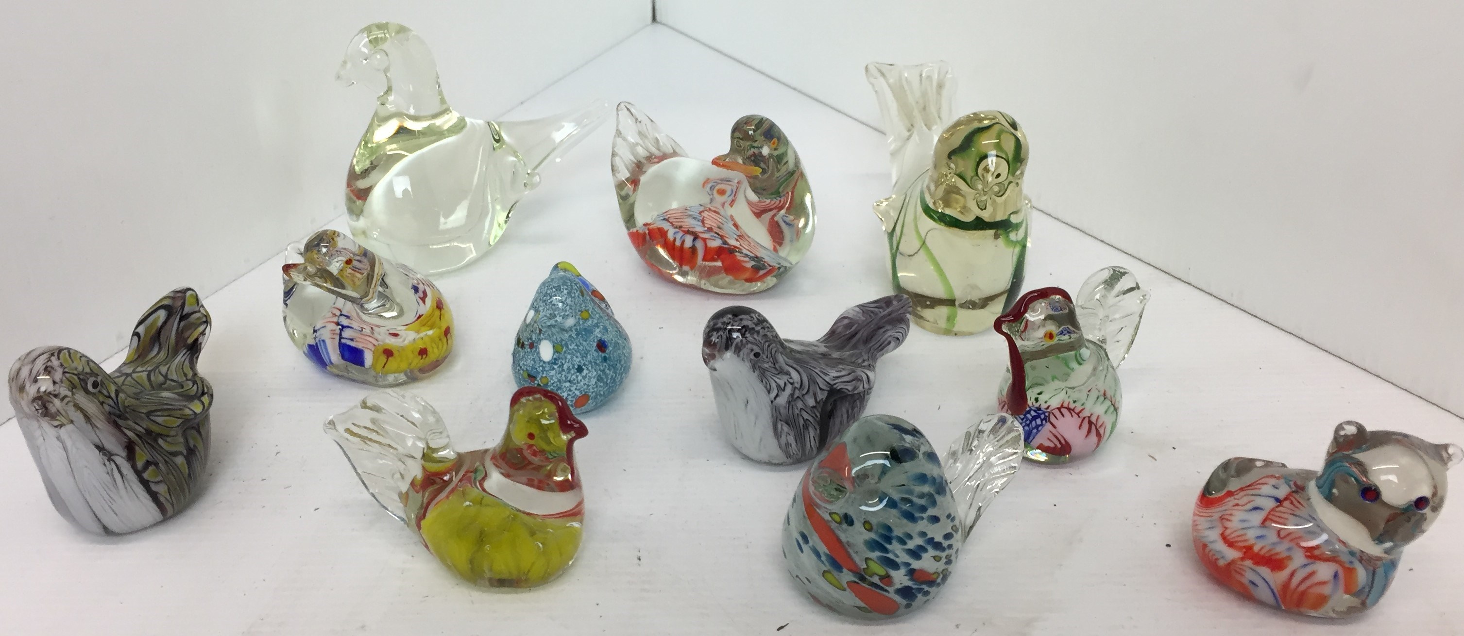 Eleven glass paperweights - ten birds from 4cm to 8cm high and one cat 5cm high (Saleroom