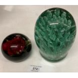 A green glass dump 14cm high and a Tarax Infinity Canadian rose patterned paperweight (saleroom