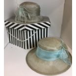 Two grey and turquoise ladies hats and black and white hat box (Saleroom location: N03)
