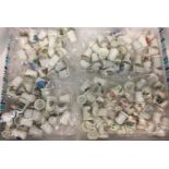 One hundred and thirty plus ceramic thimbles (Saleroom location: J01)