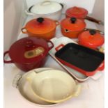 Ten pieces of enamelled cast iron oven to tableware including 1.