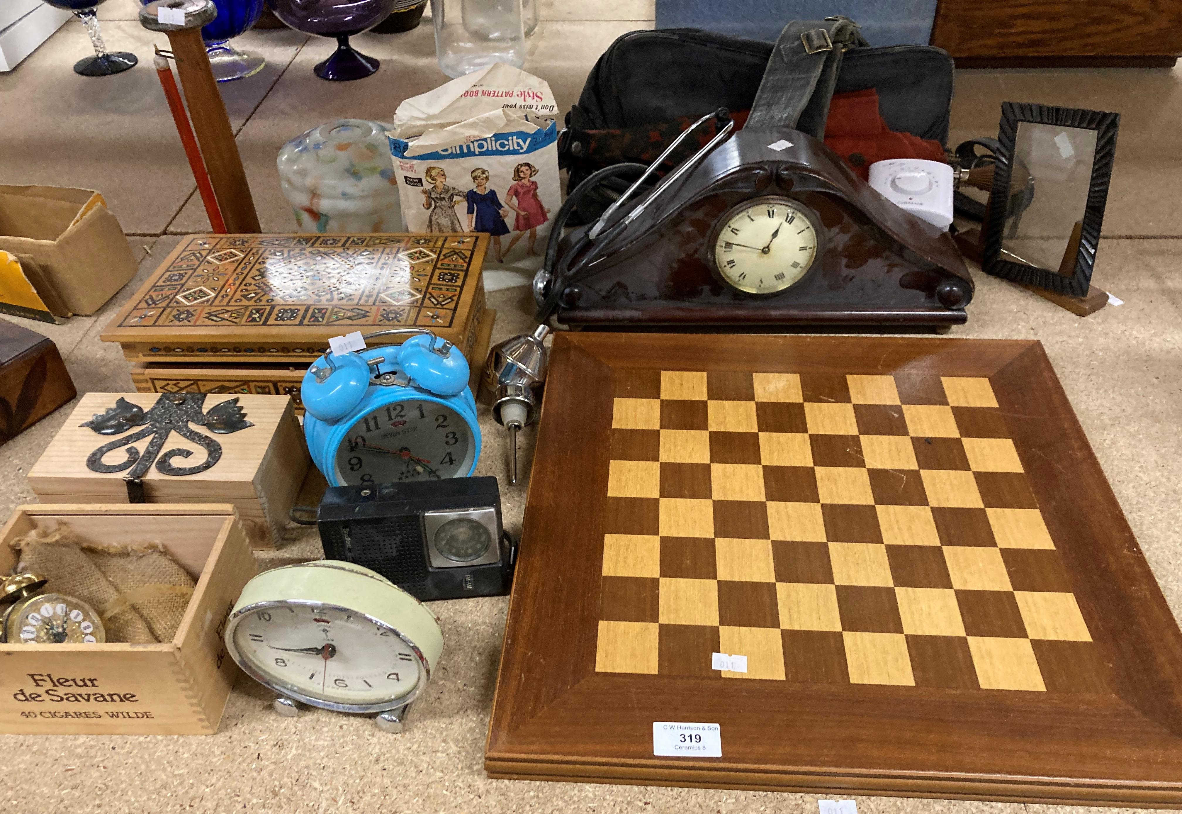 Contents to part of rack - wood chess board, mahogany mantel clock, coloured glass light shade,