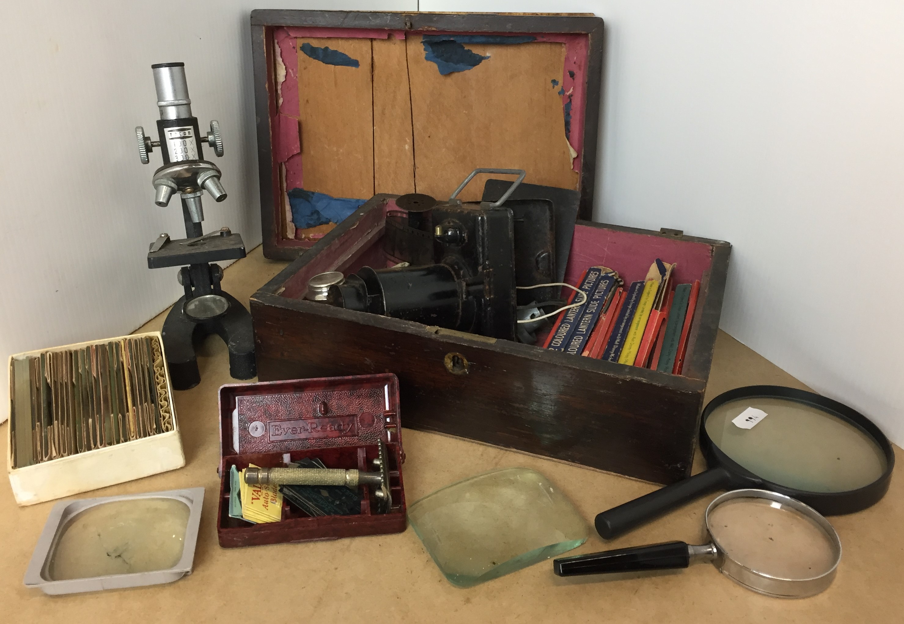 Wooden box containing slide lantern and quantity of slides, microscope and box of slides,