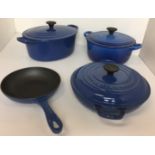 Four pieces of blue Le Creuset cast iron oven to tableware including three casseroles sizes 25
