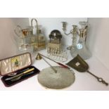 Eleven items including three arm candelabra, two decanter metal tantalus,