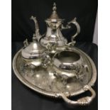 Four pieces of silver plate F P Rogers three piece tea service and galleried oval tray (Saleroom
